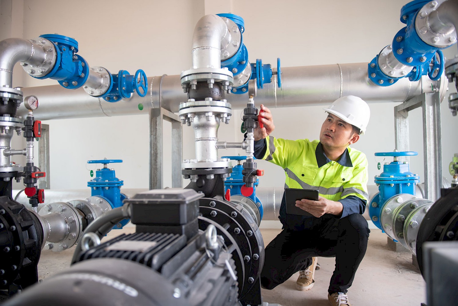 worker-checking-water-pressure-adjustments-2.jpg