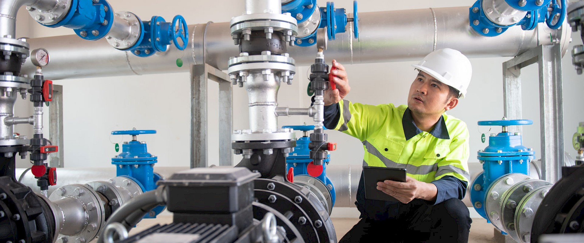 worker-checking-water-pressure-adjustments.jpg