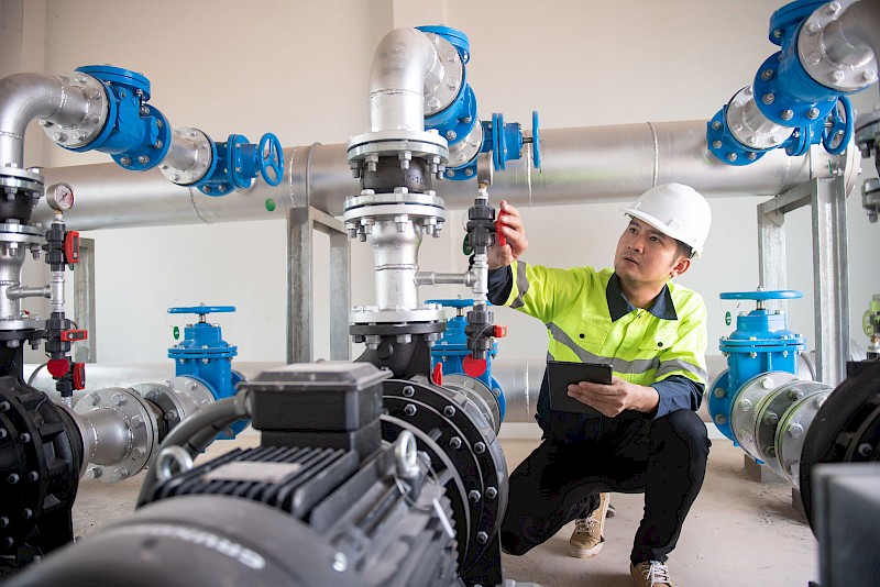 worker-checking-water-pressure-adjustments.jpg