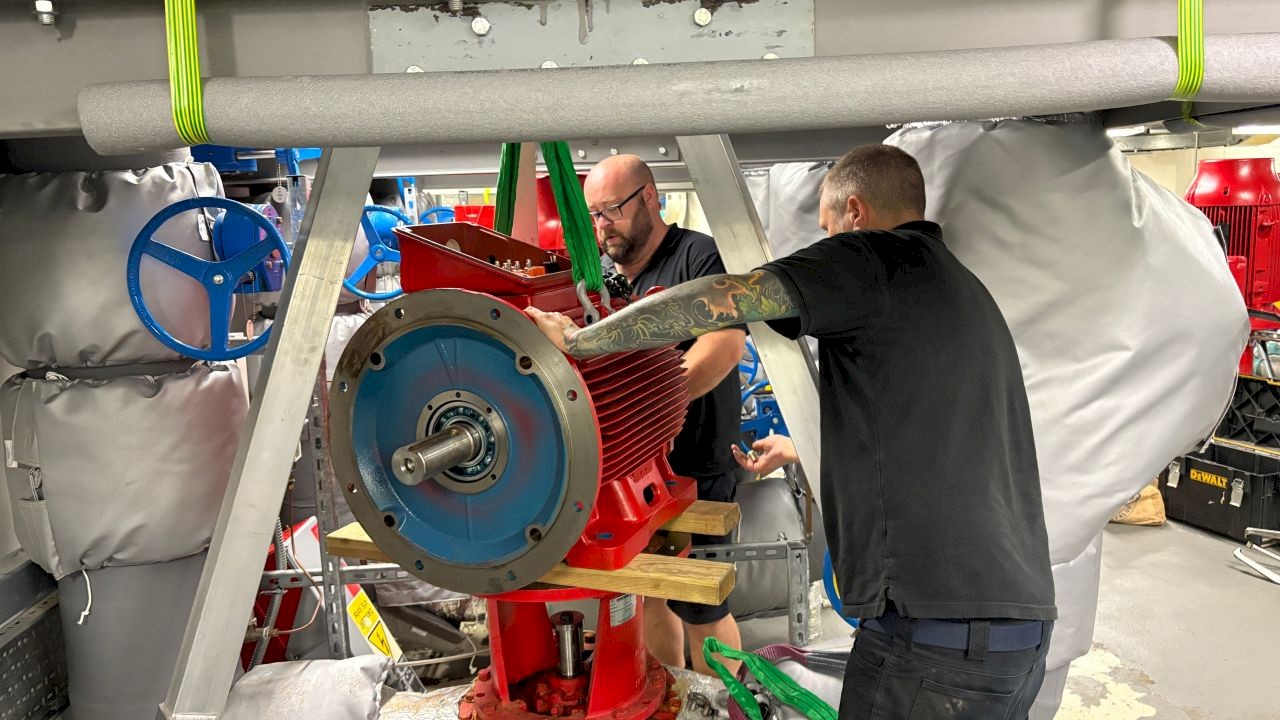 Engineers performing Lift and Shift services for pump